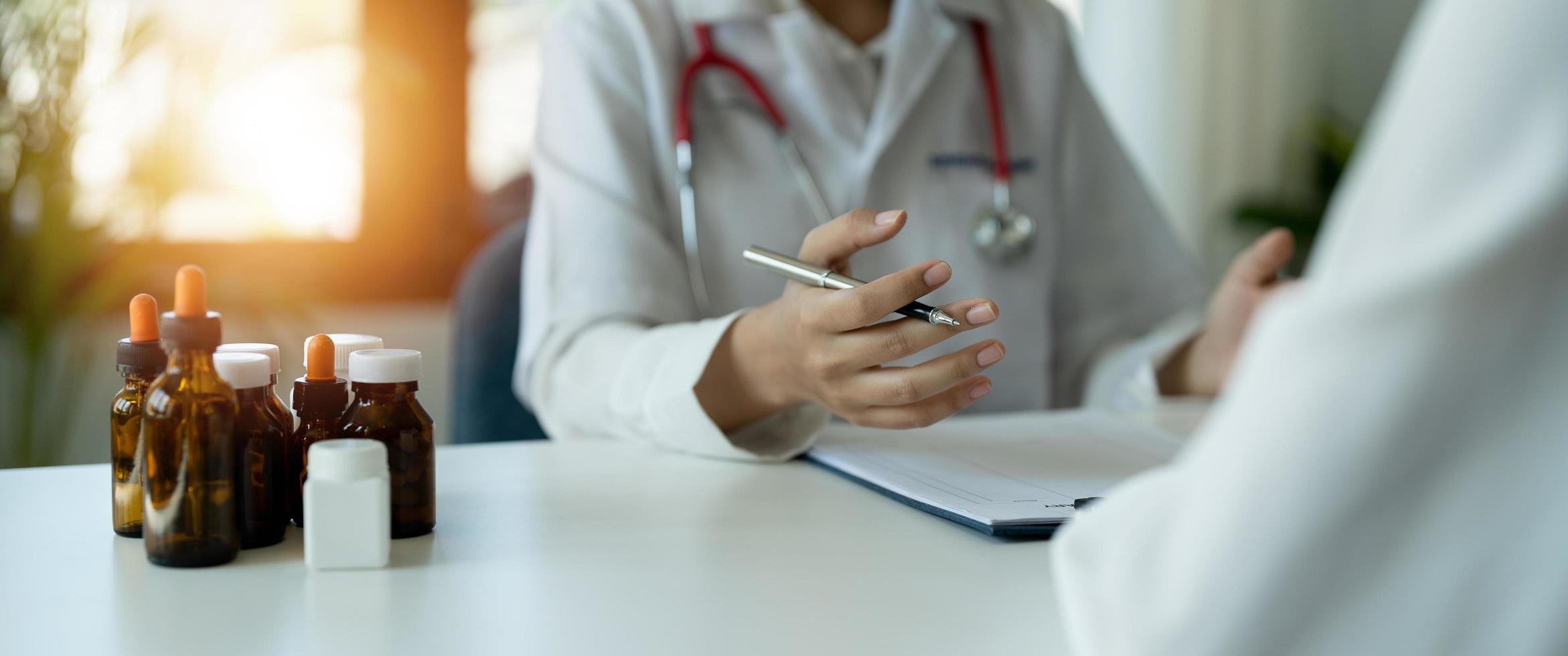 Crop shot of doctor and patient are discussing at clinic. photo