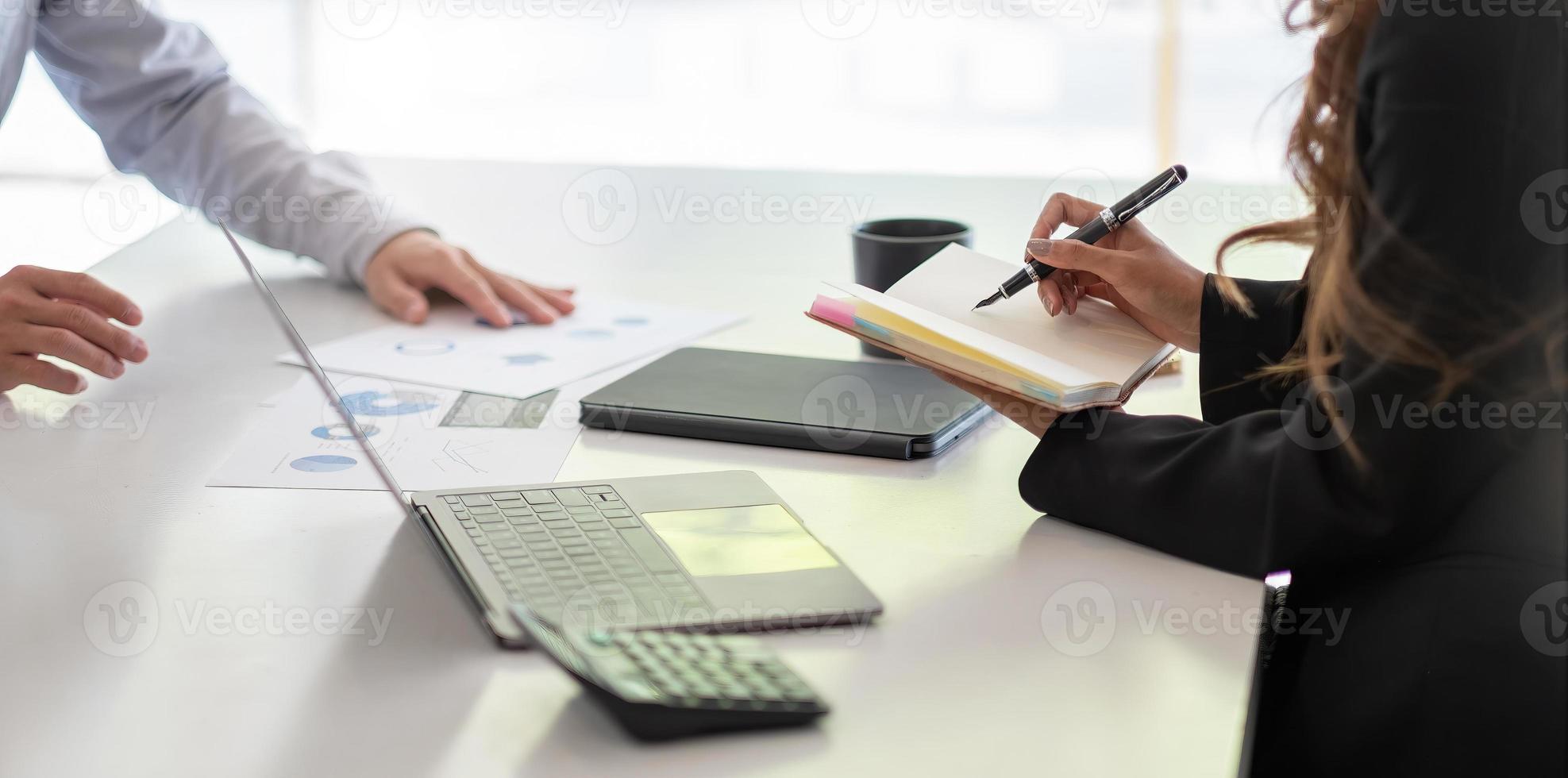 Asian business adviser meeting to analyze and discuss the situation on the financial report in the meeting room.Investment Consultant,Financial Consultant,Financial advisor and accounting concept photo