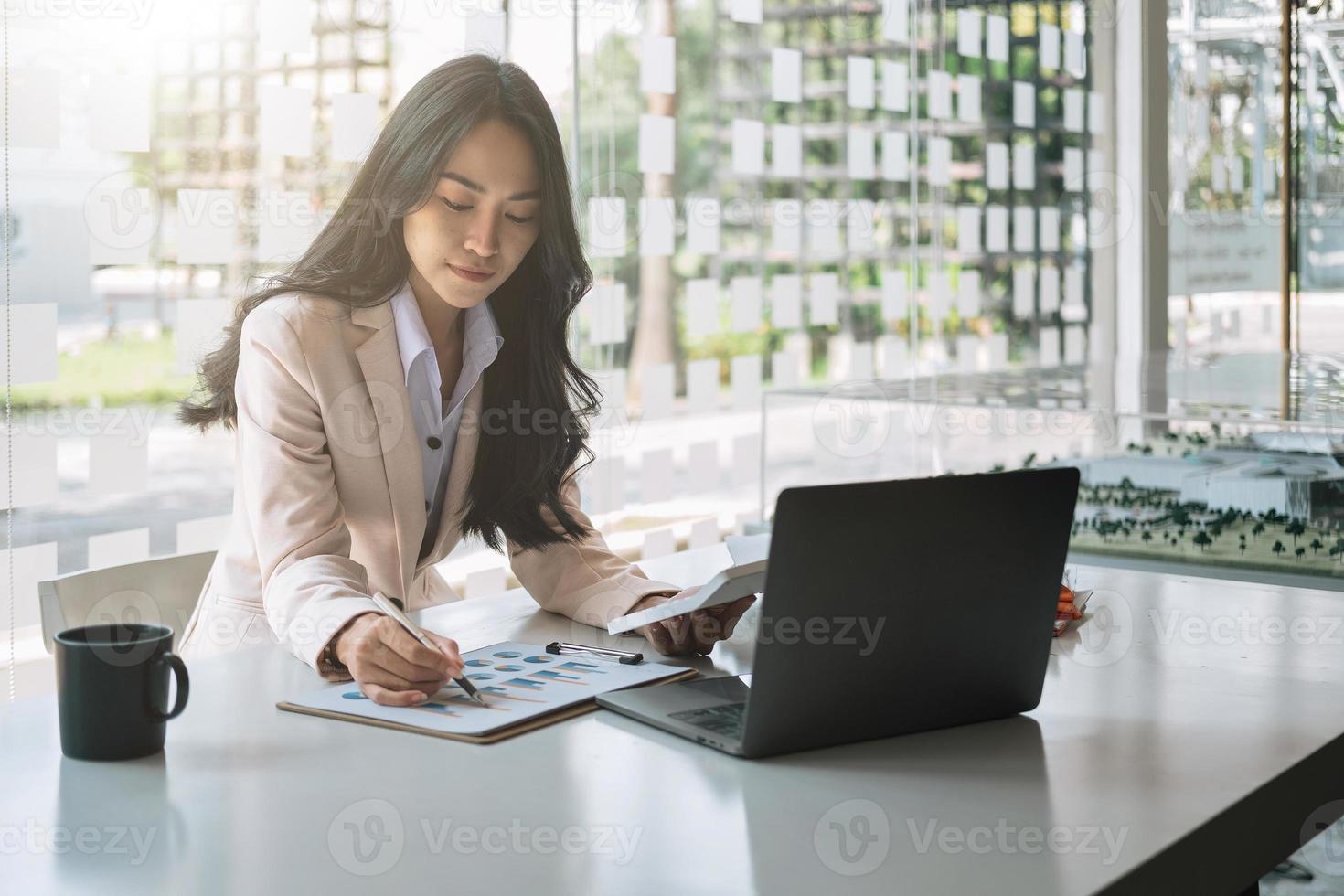 business asian woman working data document graph chart report marketing research development planning management strategy analysis financial accounting calculation photo