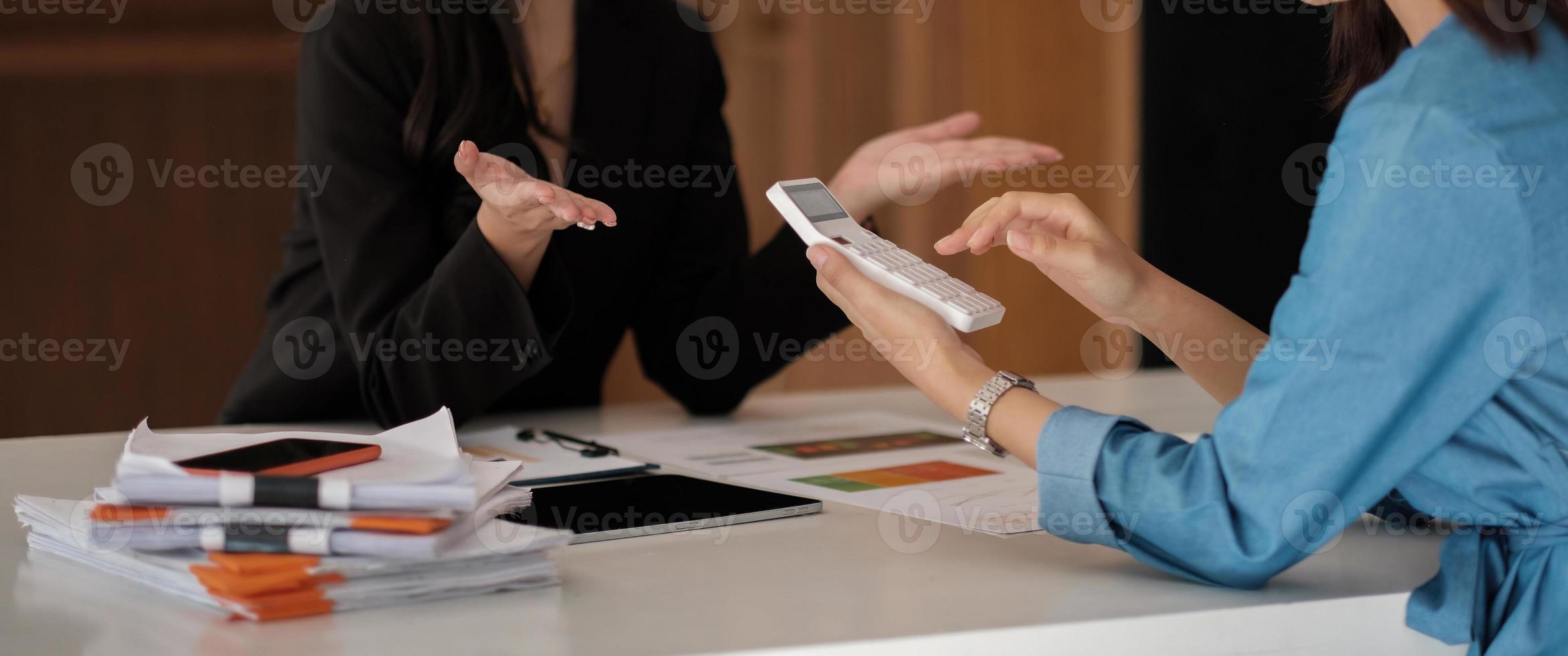 Business asian people analyzing investment graph meeting brainstorming and discussing plan in meeting room, investment number calculation concept photo