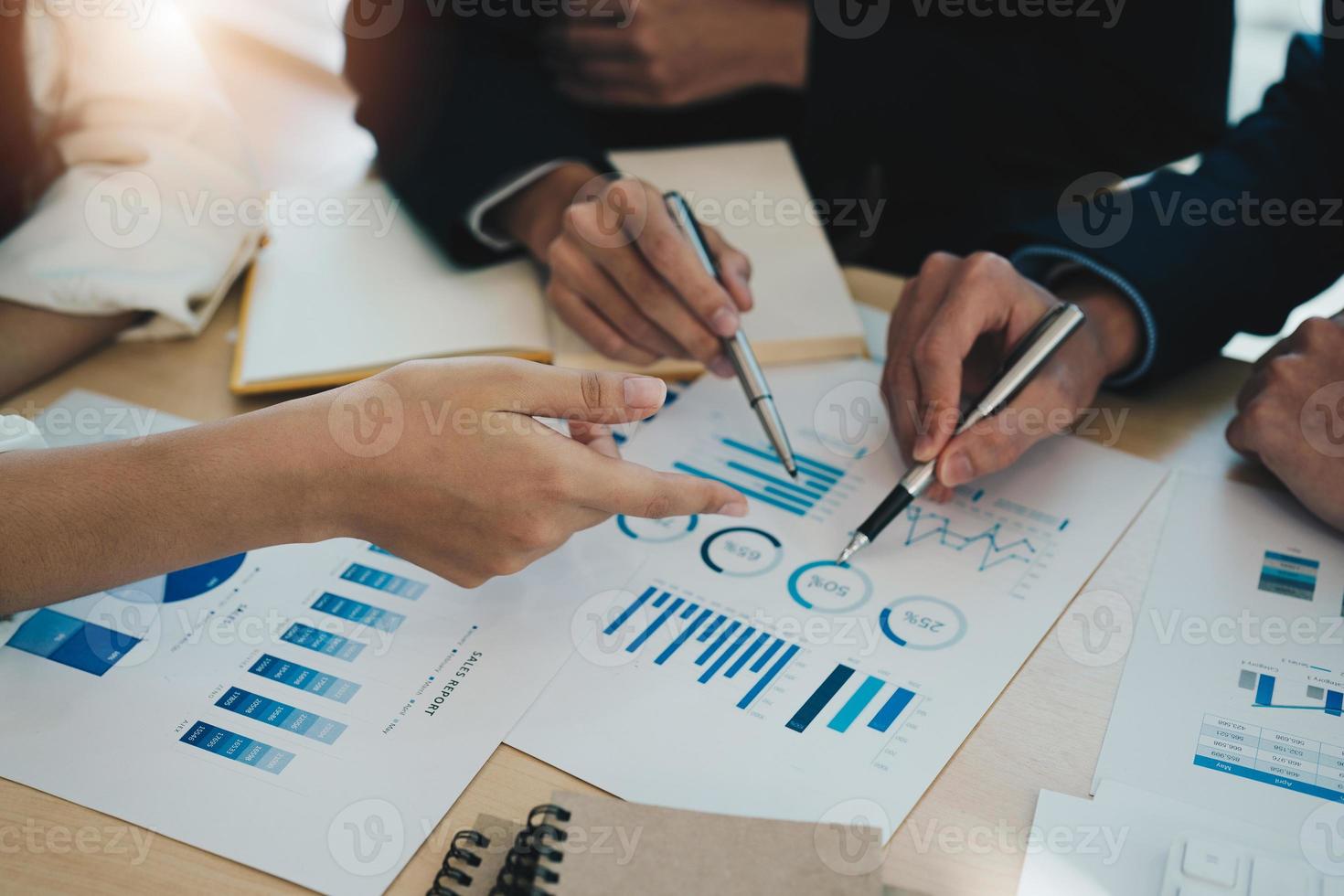 Business people consulting meeting working and brainstorming new business project finance investment concept. Analyzing business information graph chart photo