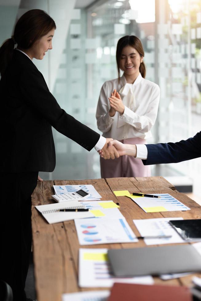 Business people shaking hands, finishing up meeting, business etiquette, congratulation, merger and acquisition concept photo