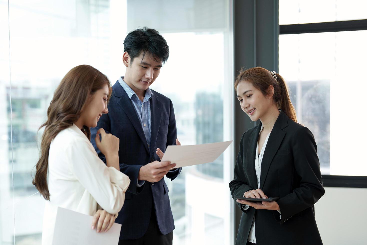 Business asian people having a business meeting. Happy diverse business team young and old workers talking brainstorming on project in office photo