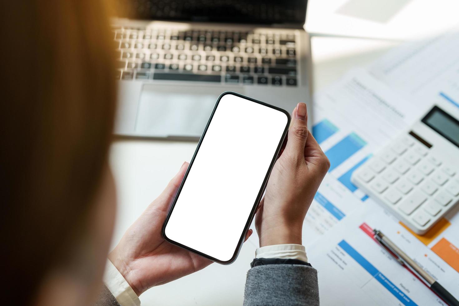 Cropped shot view of woman hands holding smart phone with blank copy space screen for your text message or information content. photo