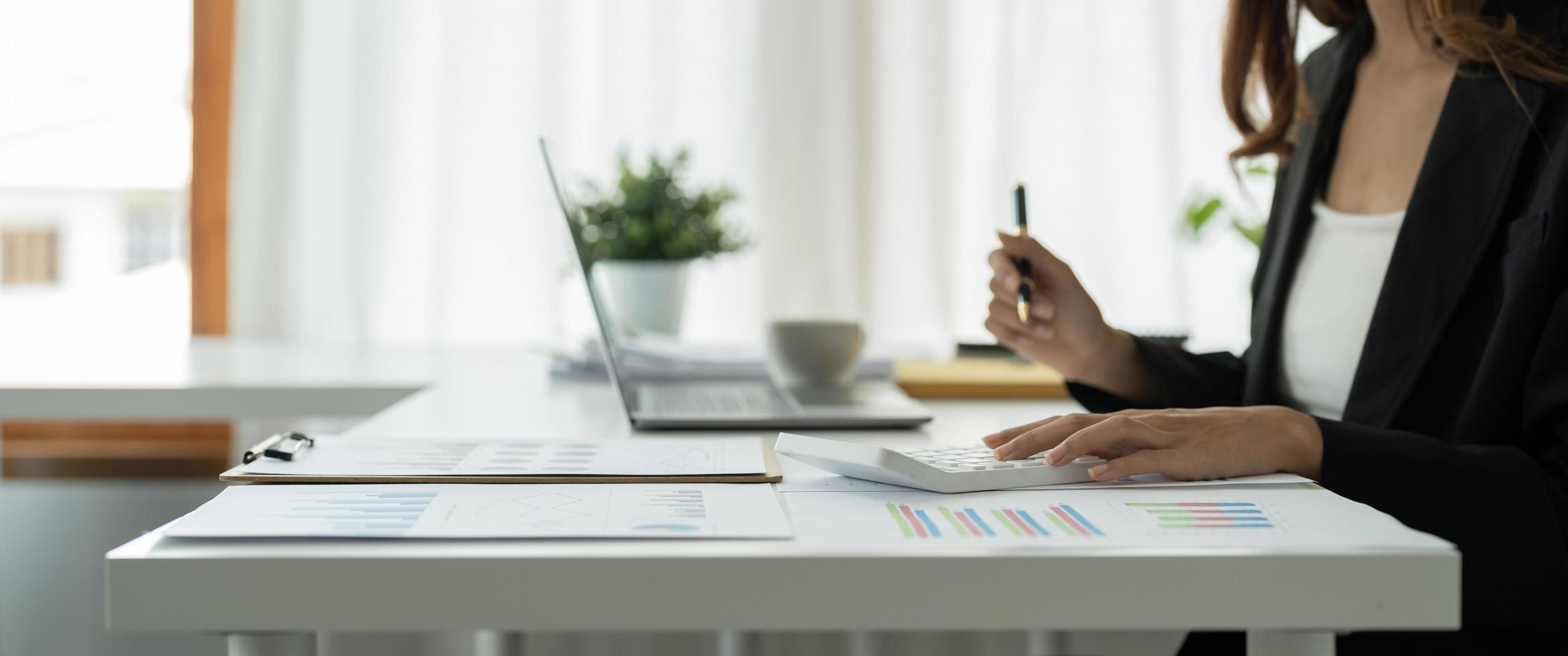 Close up view of bookkeeper or financial inspector hands making report, calculating or checking balance. Home finances, investment, economy, saving money or insurance concept photo