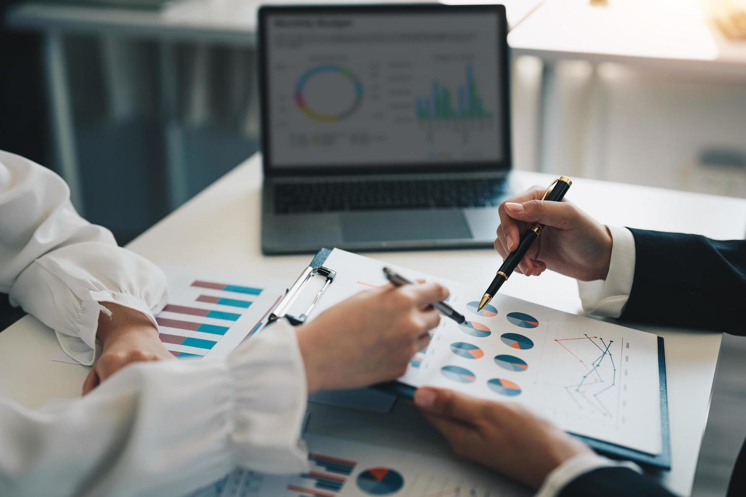 Business adviser analyzing financial figures denoting the progress in the work of the company, business and investment concept. photo