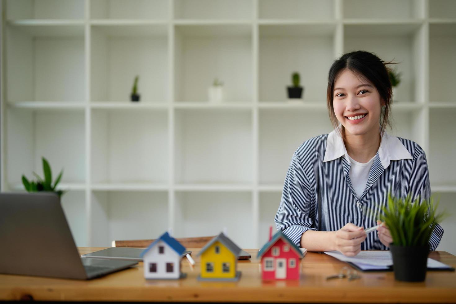 Portrait real estate agent working with contract agreement on workplace photo