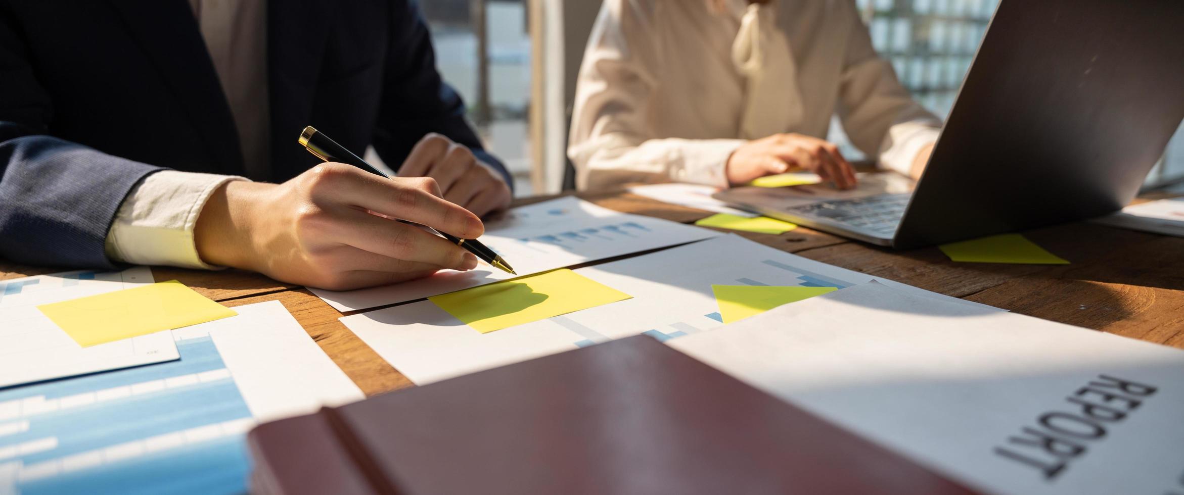 Businessman working analyzing and calculate expense financial annual report photo