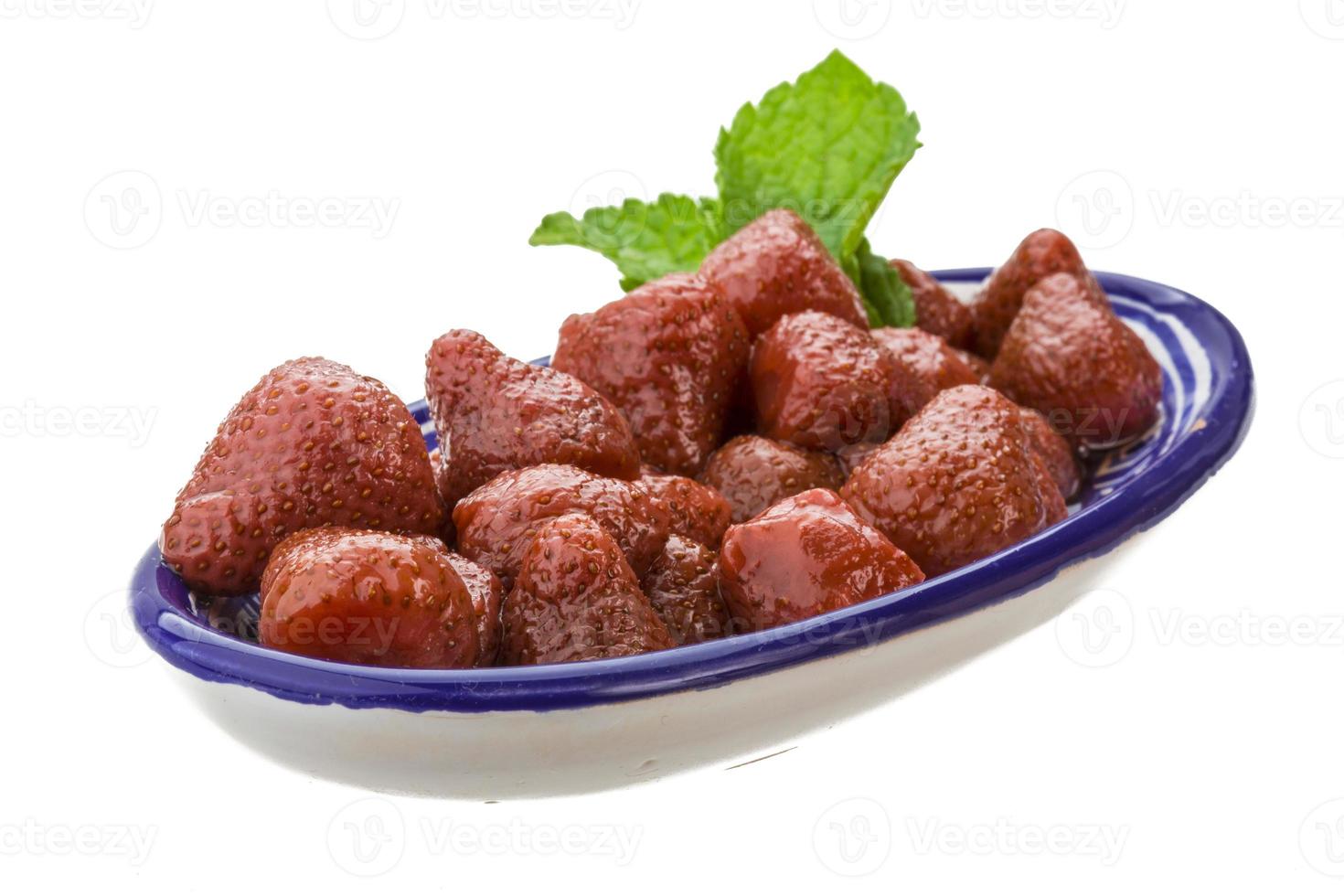 Marinated strawberry on white photo