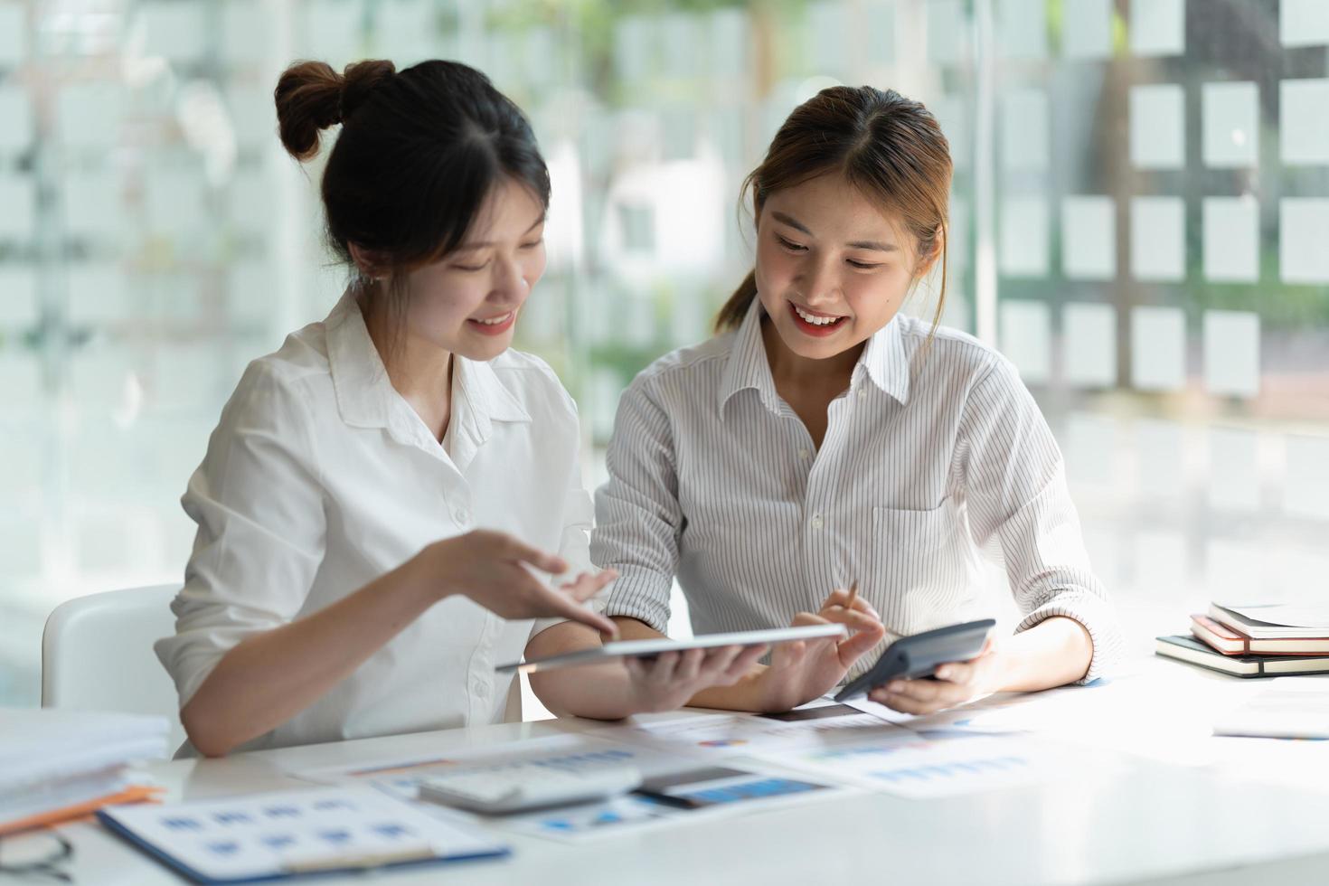 Two business colleague meeting to brainstorm the new project business strategy plan and analysis data document, finance and accounting concept Briefing, brainstorming, consulting photo