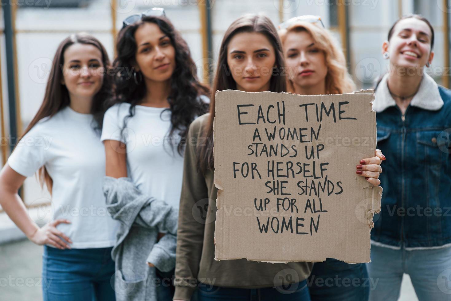 Peaceful protest. Group of feminist women have demonstration for their rights outdoors photo