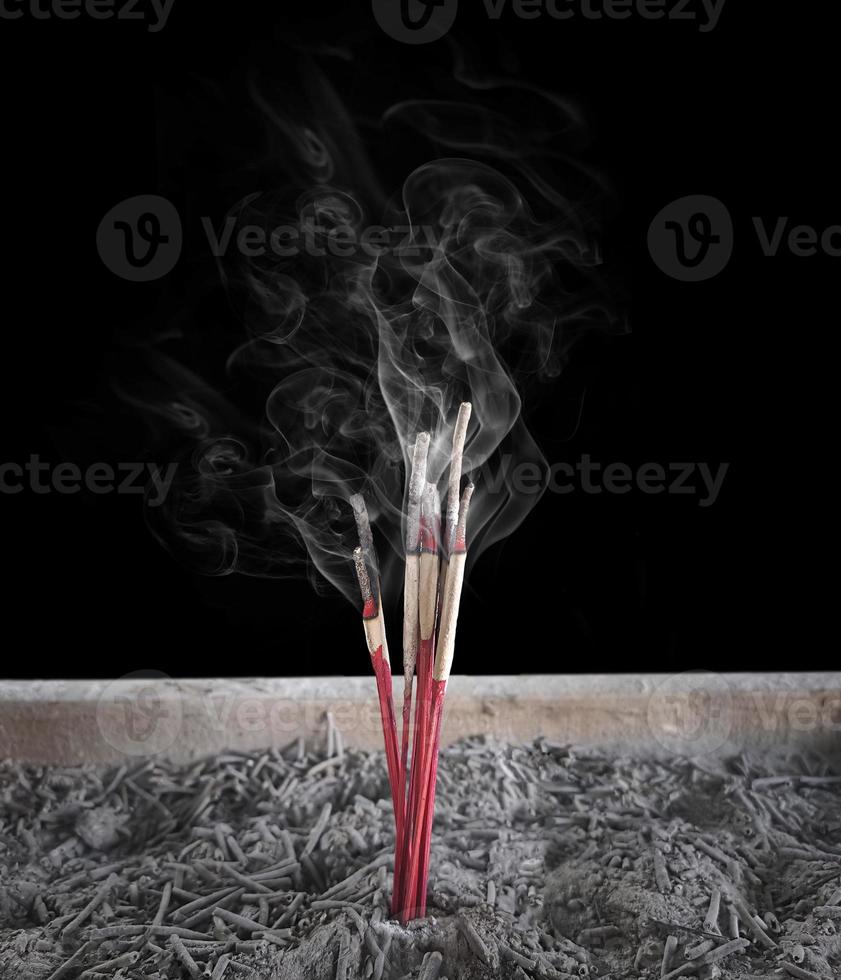 Incense burning Embossed in an incense pot. There is a lot of smoke photo