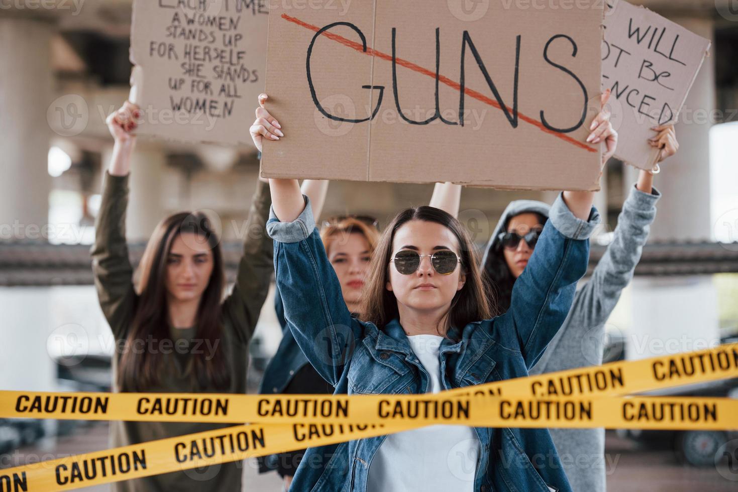 We stand by the end. Group of feminist women have protest for their rights outdoors photo