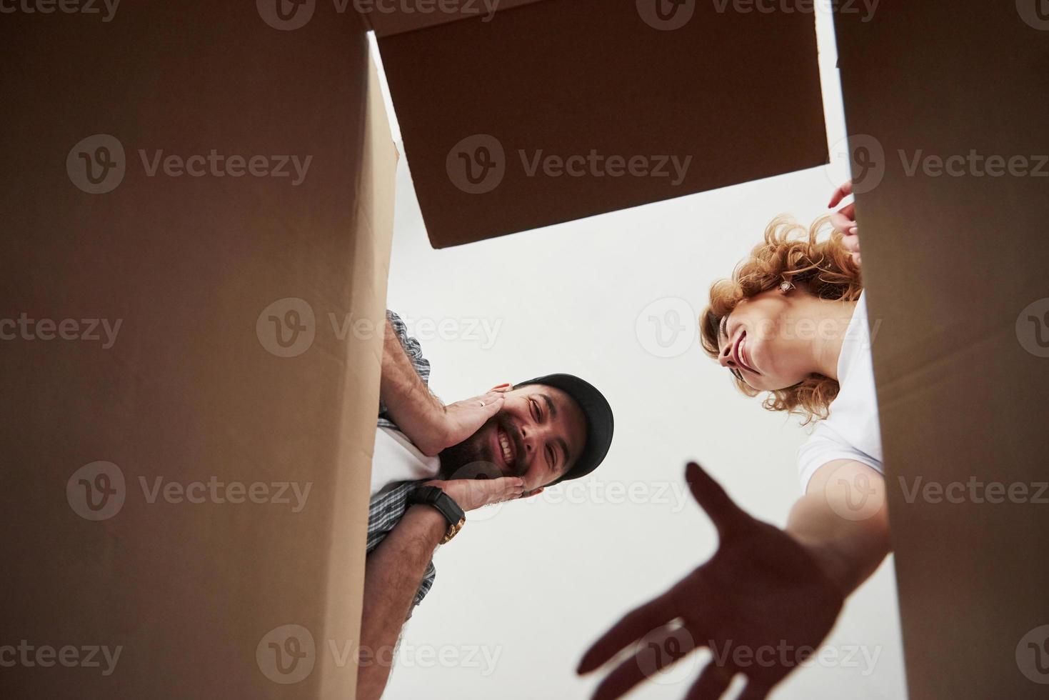 Face expression. Happy couple together in their new house. Conception of moving photo