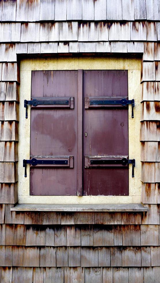 Wooden wall texture and window vertical photo