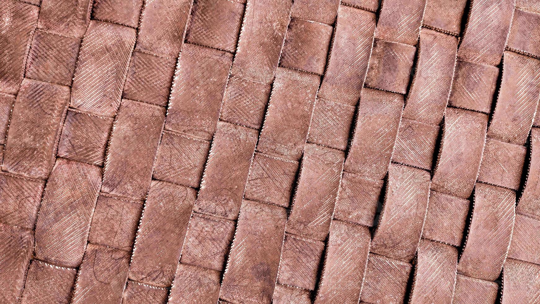 Brown pattern background for design of vehicle tires craft that become seat mats. Abstract architectural background and texture for design. Grunge background for backdrop. photo