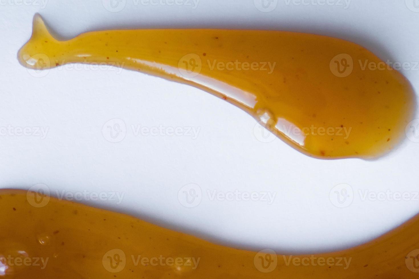 the drops of homemade sauce on a white background photo