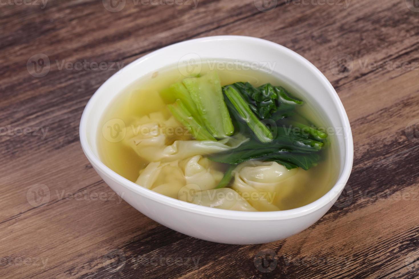 Asian traditional Wonton soup with herbs photo