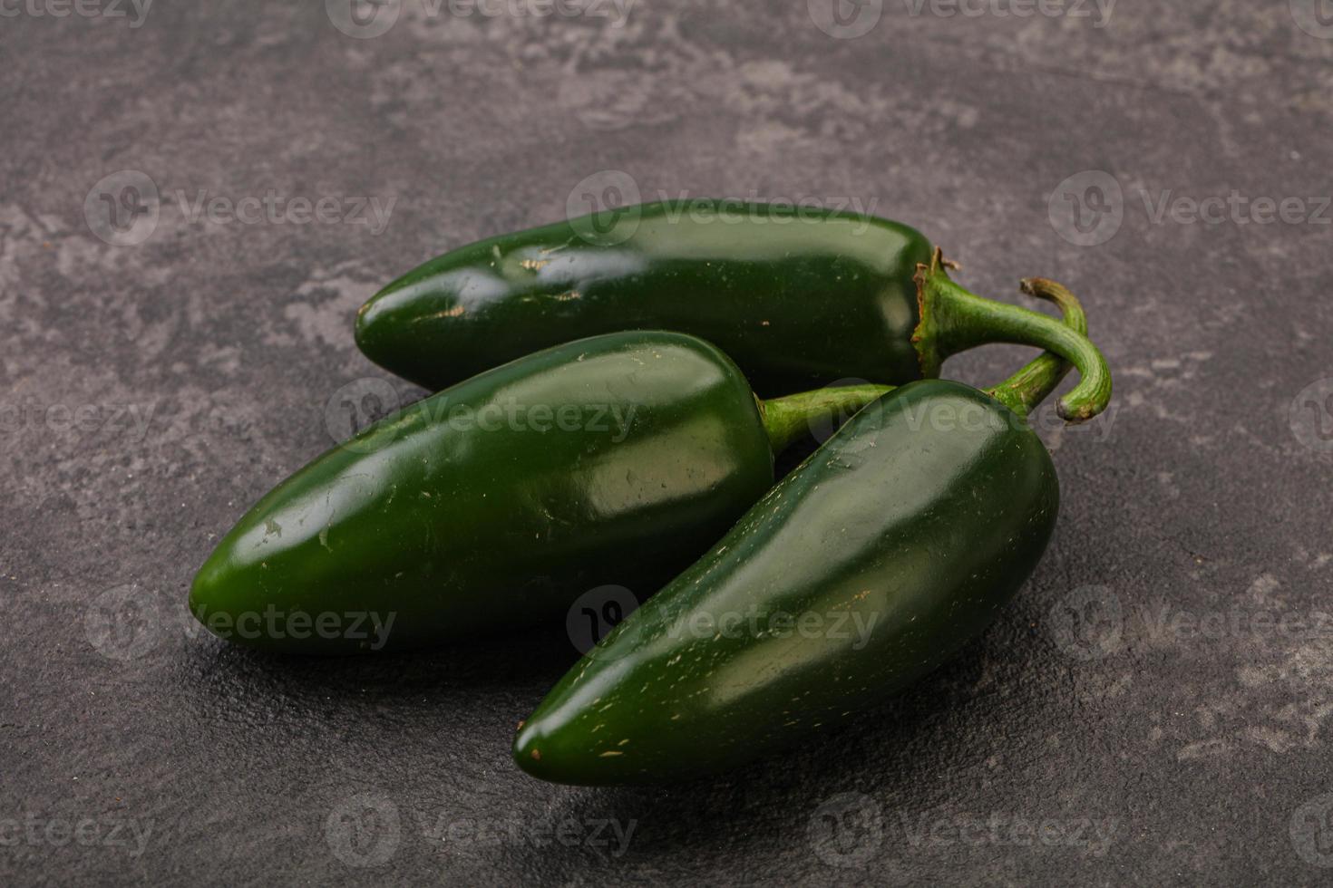 Green raw jalapeno peper heap photo