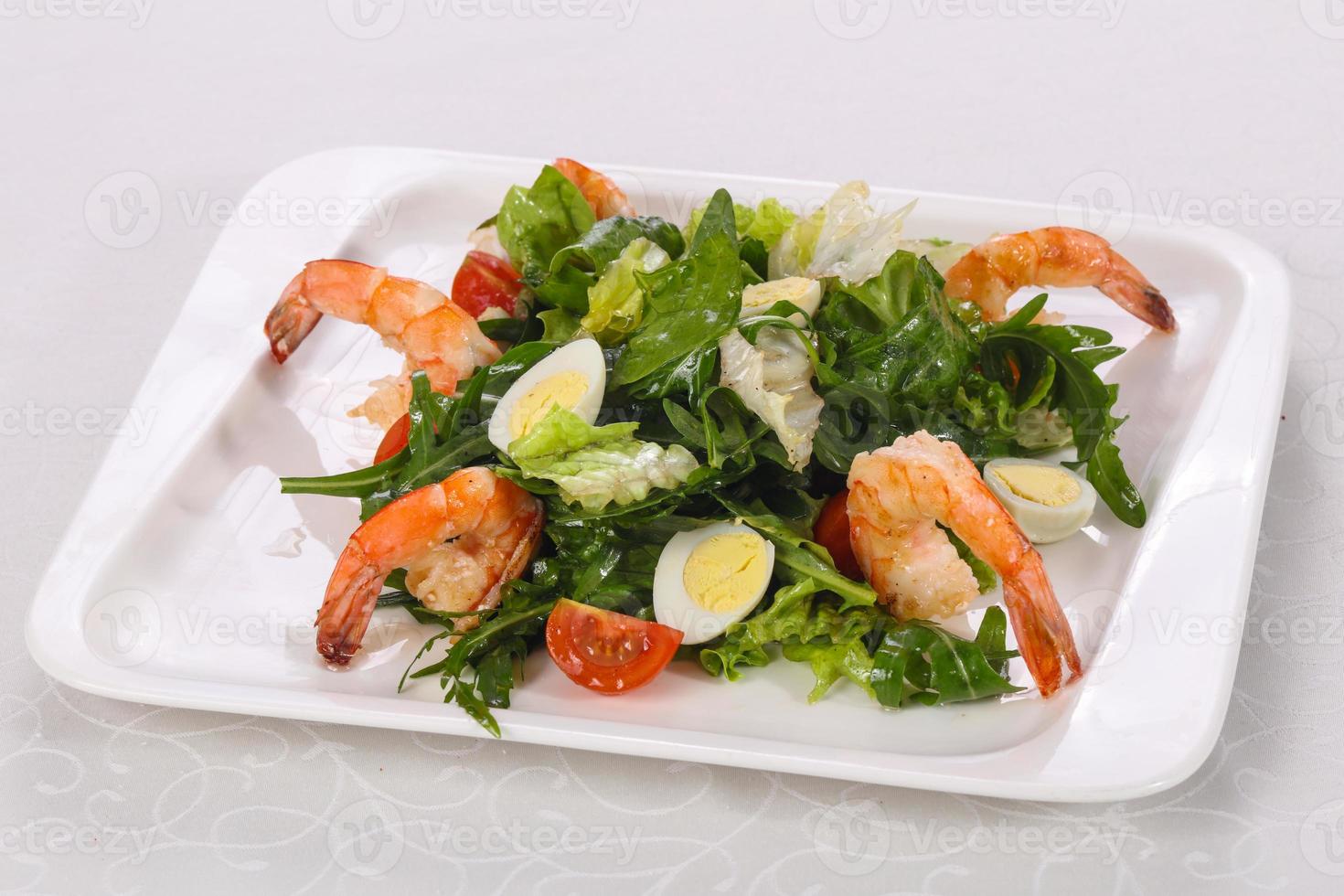 Salad with prawn, rocket and eggs photo