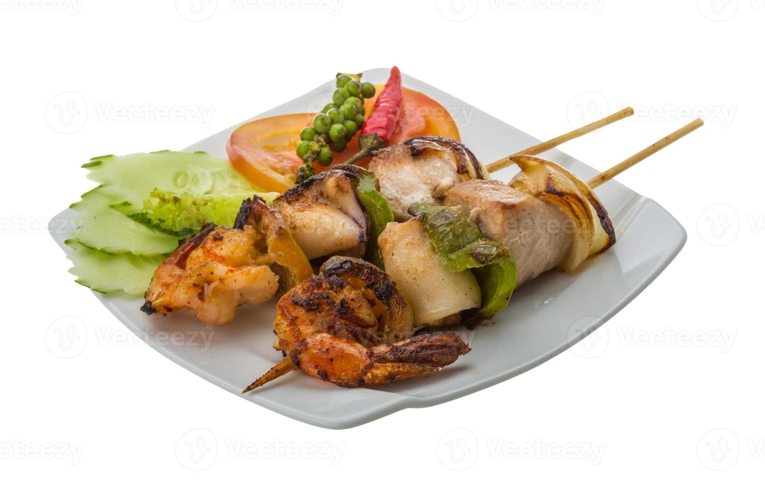 Seafood barbeque on white photo