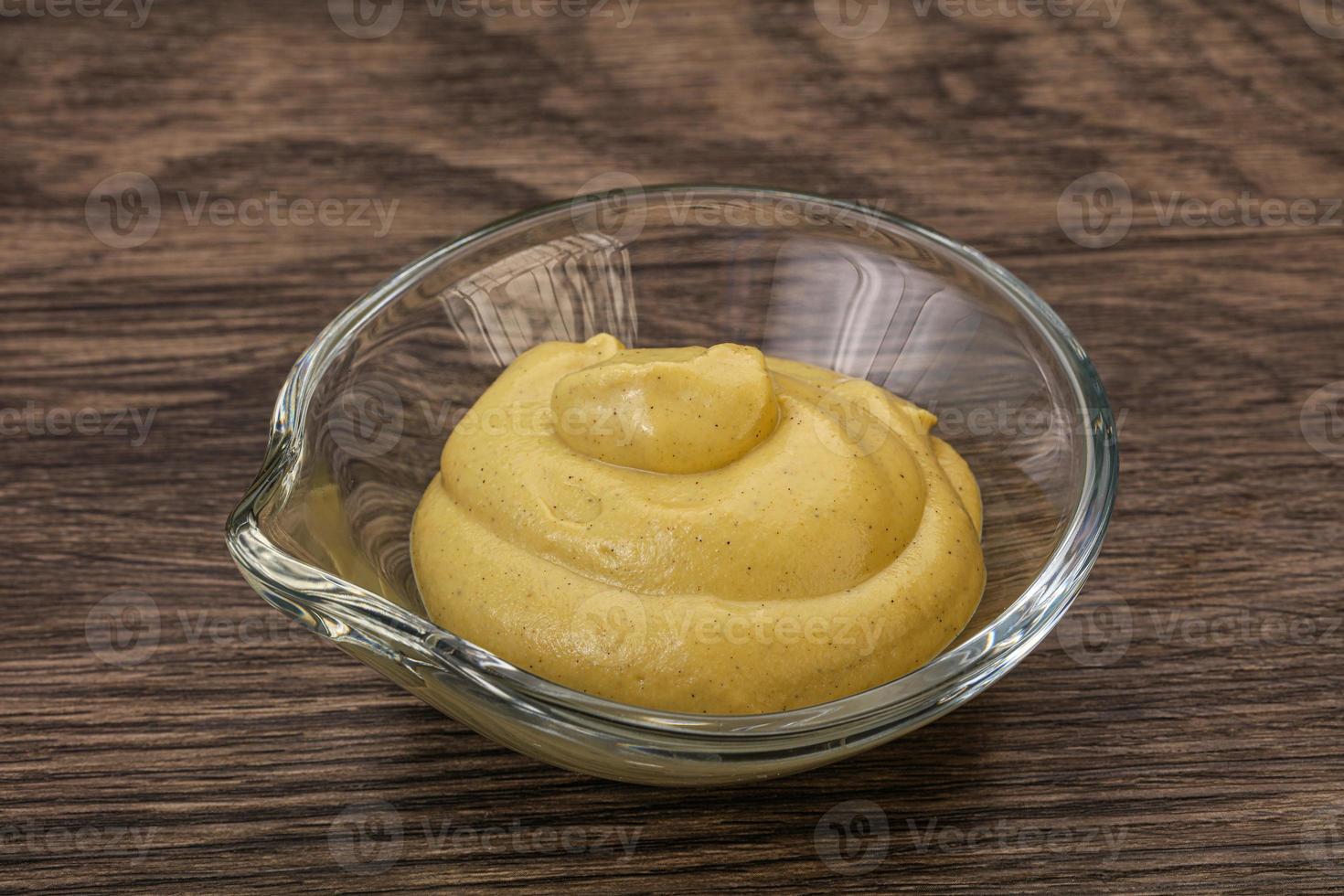 Dijon mustard sauce in the bowl photo