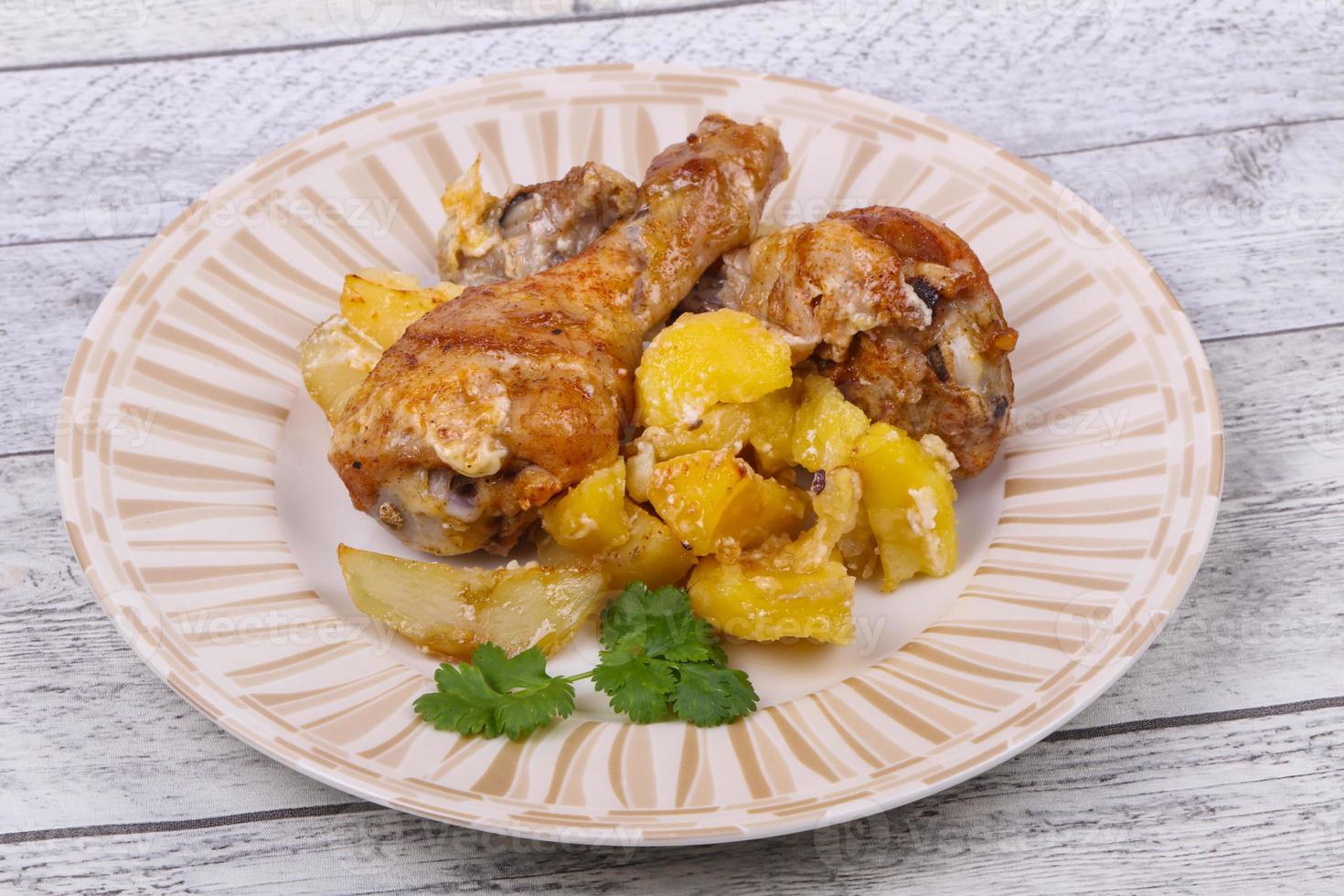 Roasted chicken legs with potato photo