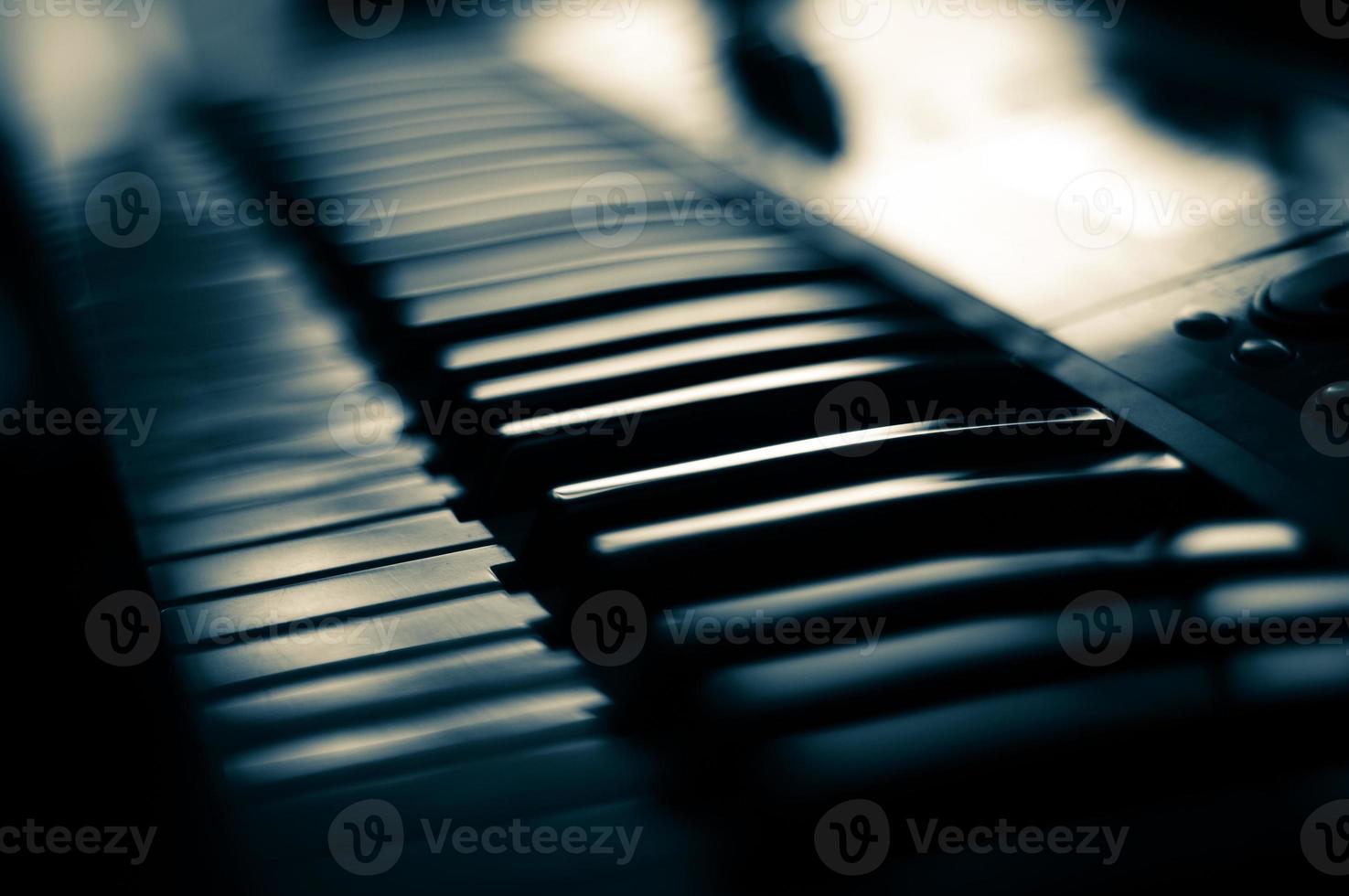 Piano keyboard close up view with shallow depth of field focus. photo