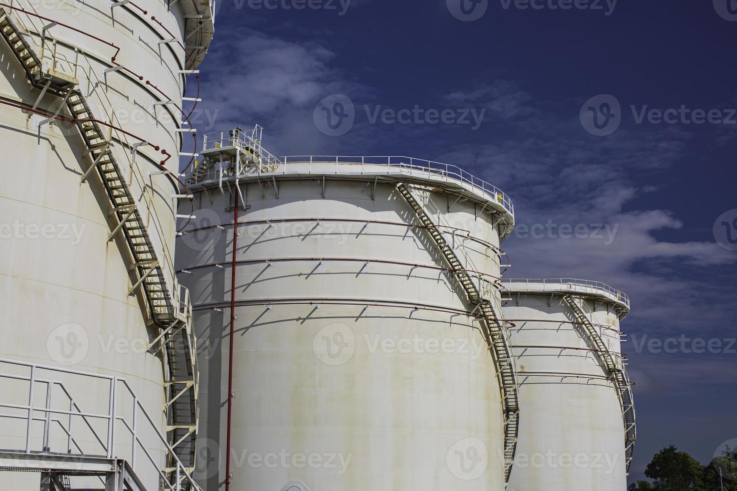 Row of large white tanks for oil photo