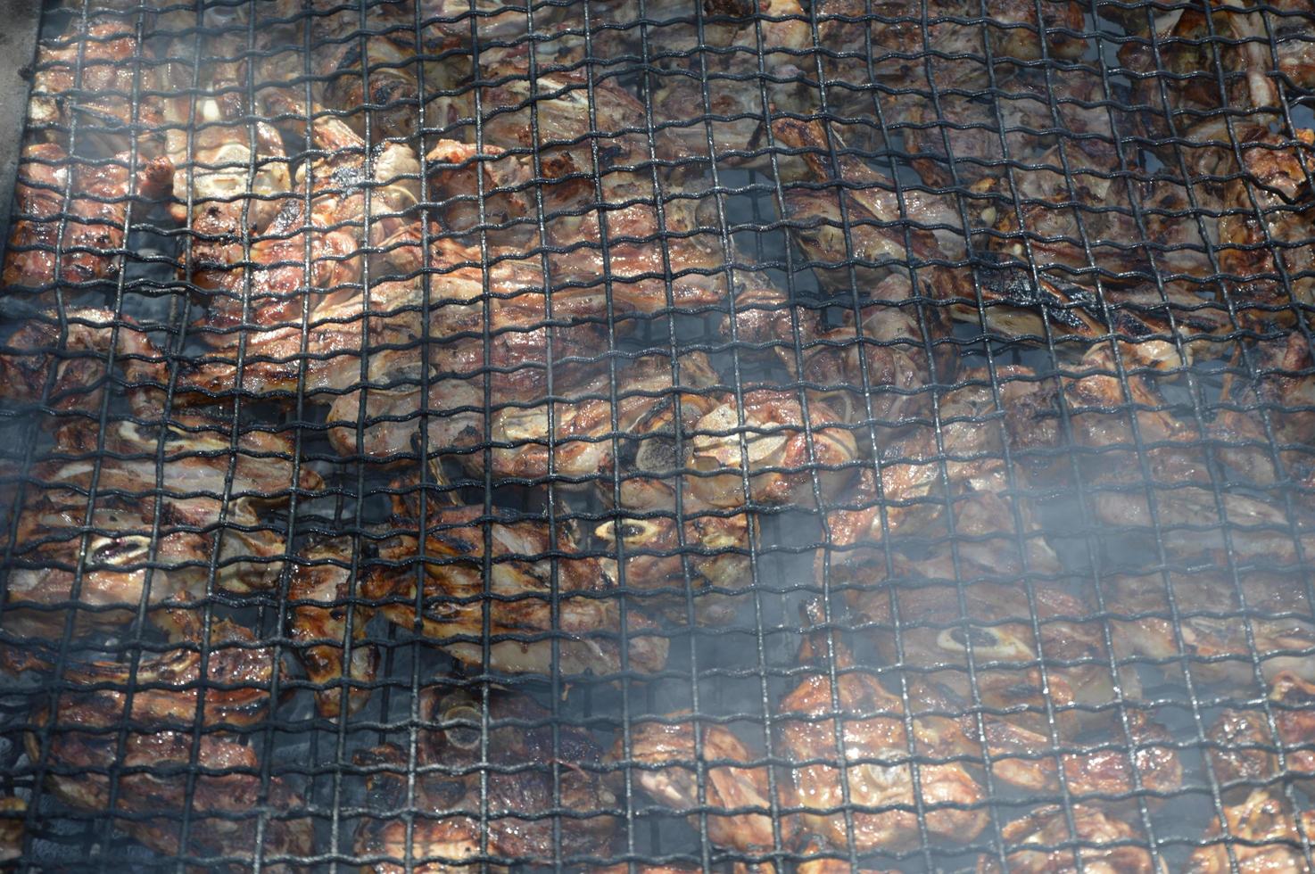 Lamb ribs on the grill photo