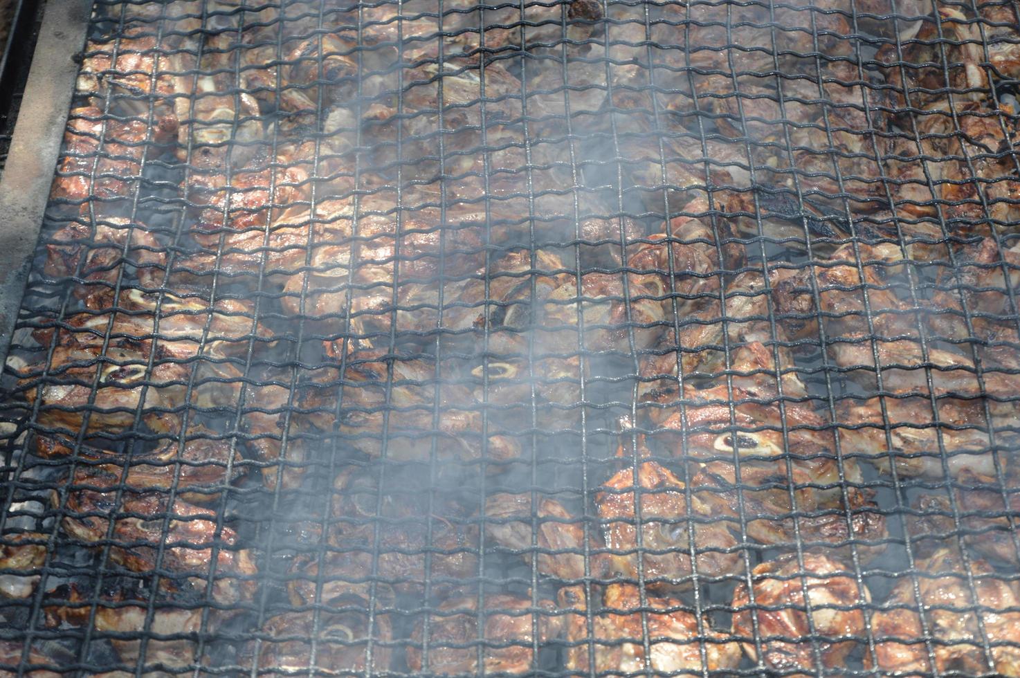 Lamb ribs on the grill photo