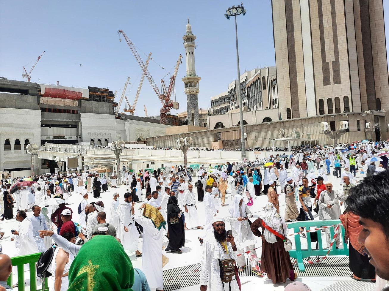 Mecca, Saudi Arabia, June 2022 - At the Masjid al-Haram in Mecca, pilgrims from all over the world gather in the outer courtyard after the Friday prayers. photo