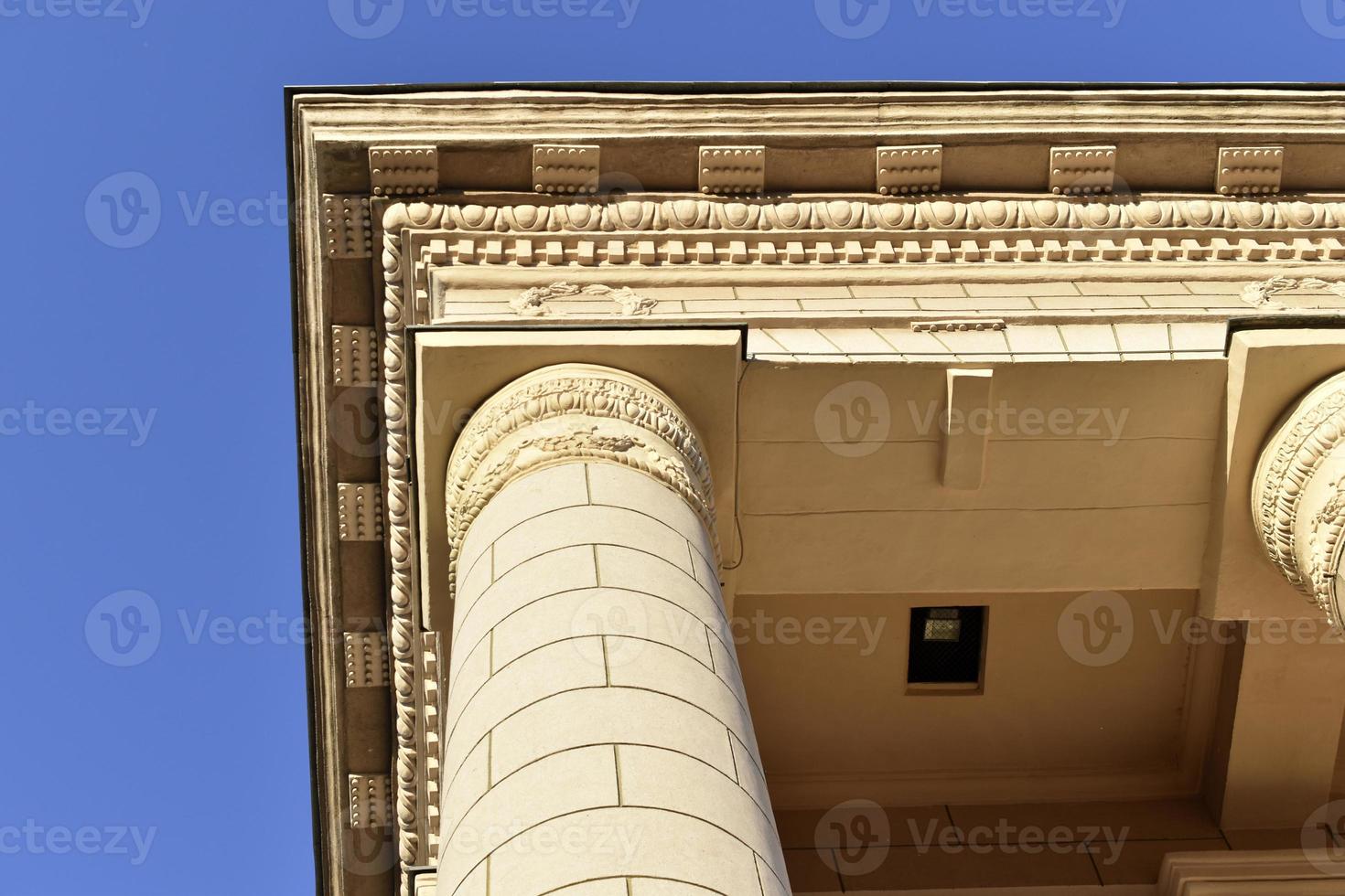 Classic yellow large building with columns in the evening photo