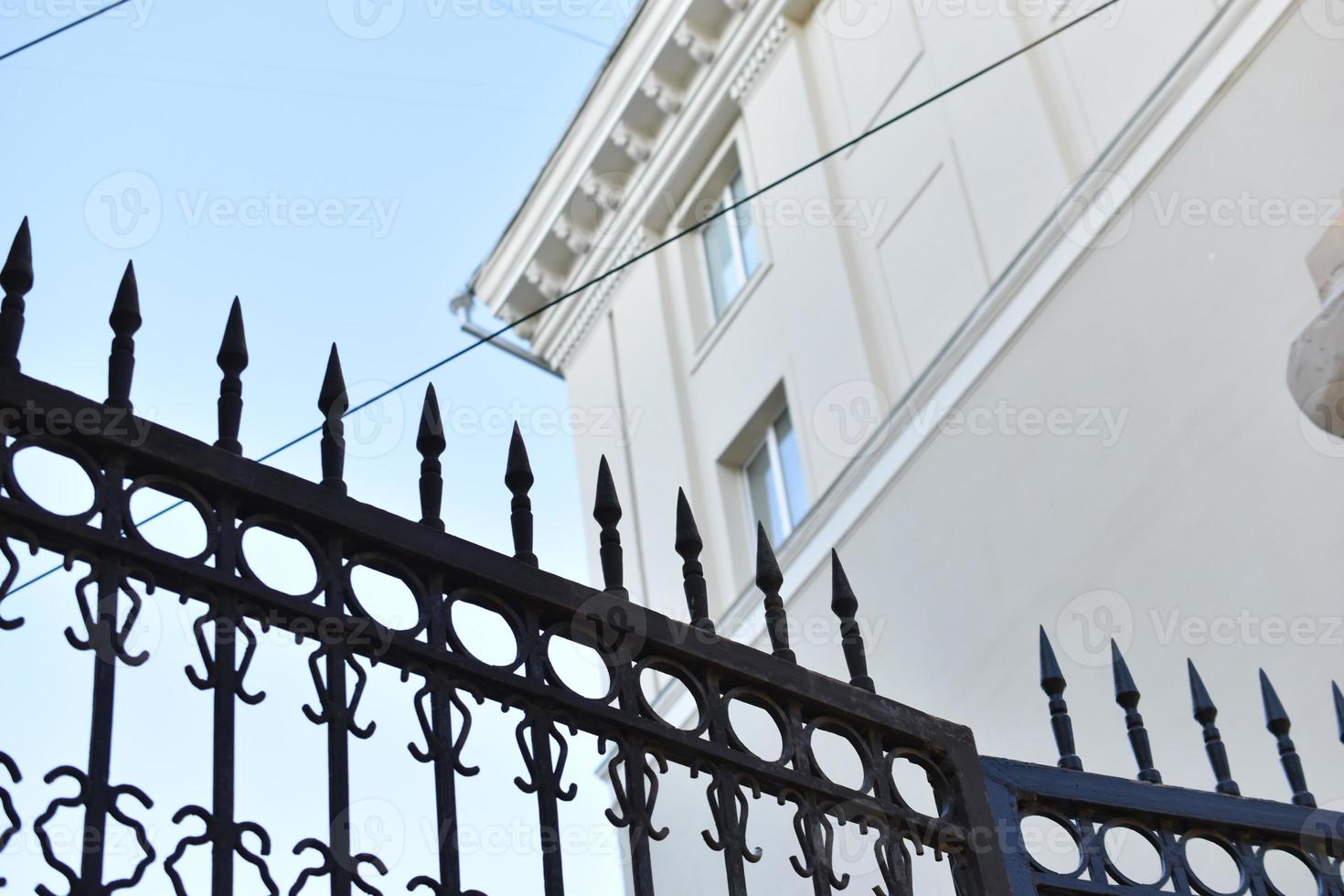 Abstract iron fence stakes gates for digital wallpaper design. Abstract concept. Design element. Modern design. Blue background. Retro style. Building architecture. photo