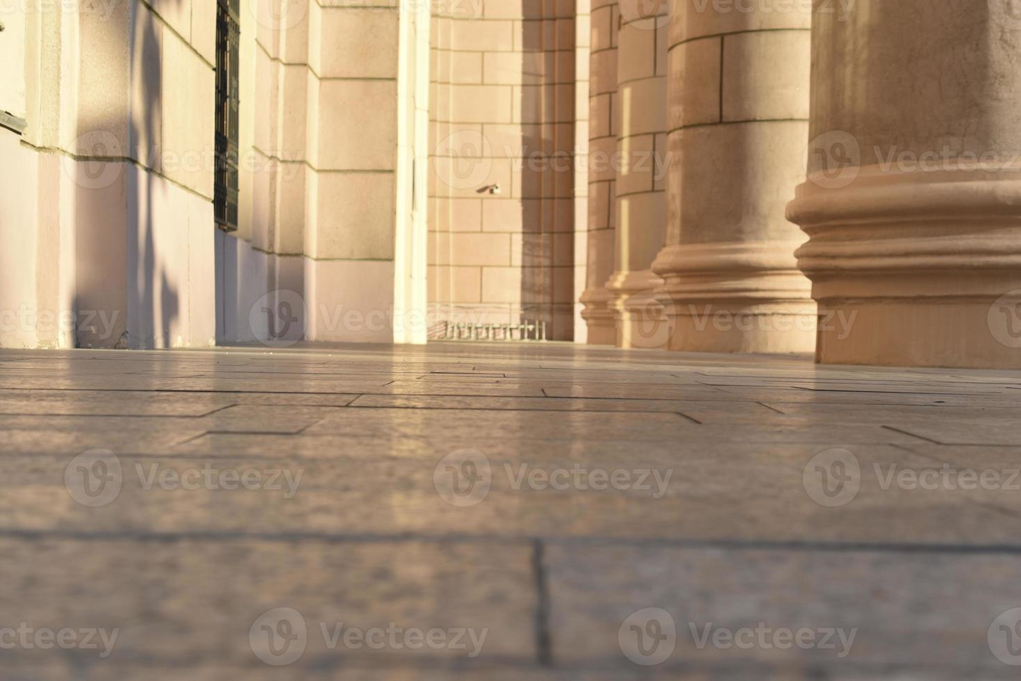 Classic yellow large building with columns in the evening photo