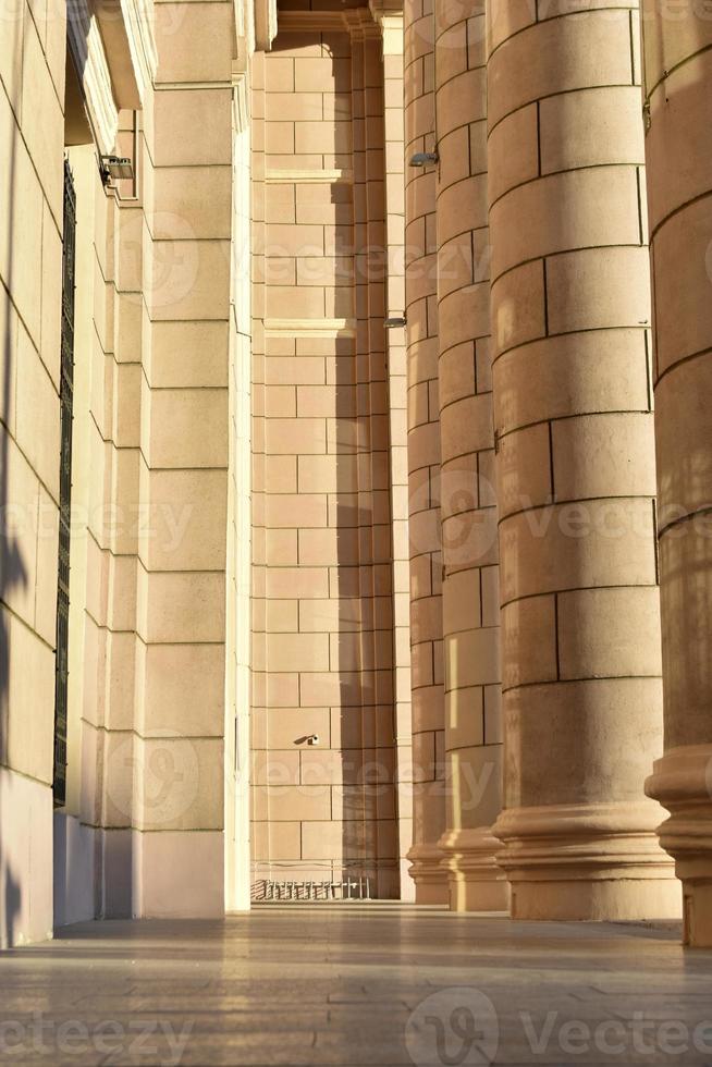 Classic yellow large building with columns in the evening photo