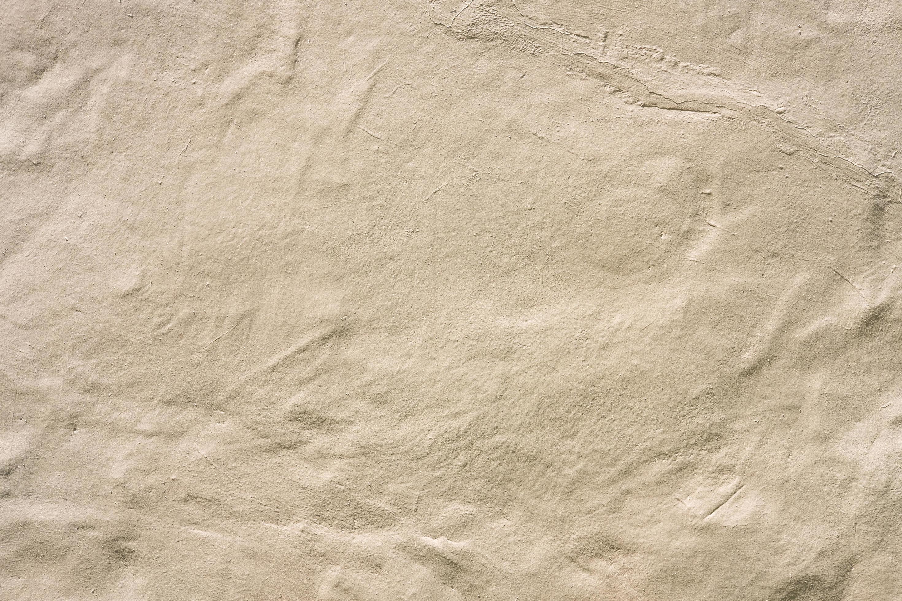 Rough surface of brown concrete which show the gradient and detail of