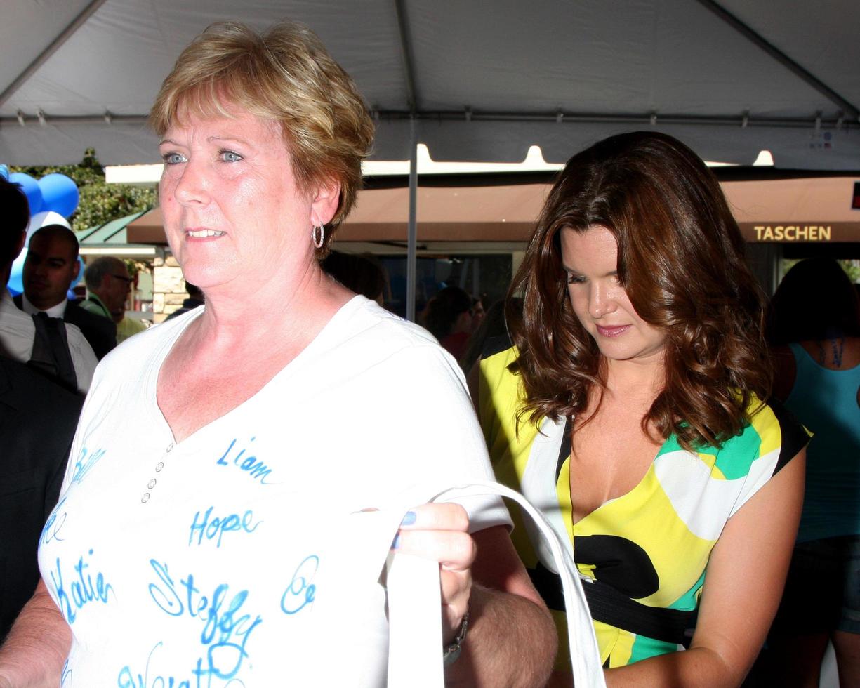 LOS ANGELES, AUG 23 -  Heather Tom autographing a fan s T shirt at the Bold and Beautiful Fan Meet and Greet at the Farmers Market on August 23, 2013 in Los Angeles, CA photo
