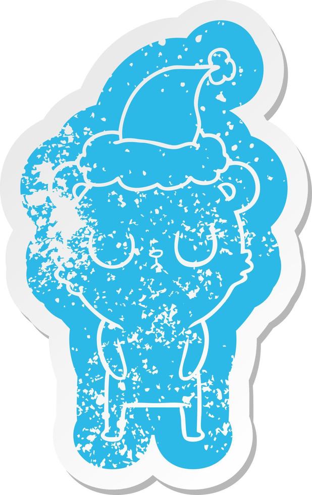 peaceful cartoon distressed sticker of a bear wearing santa hat vector