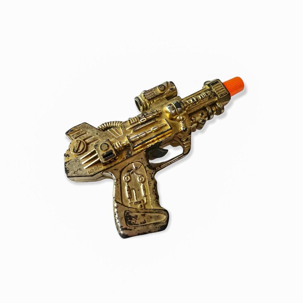 imagen de una pistola de juguete sobre un fondo blanco foto