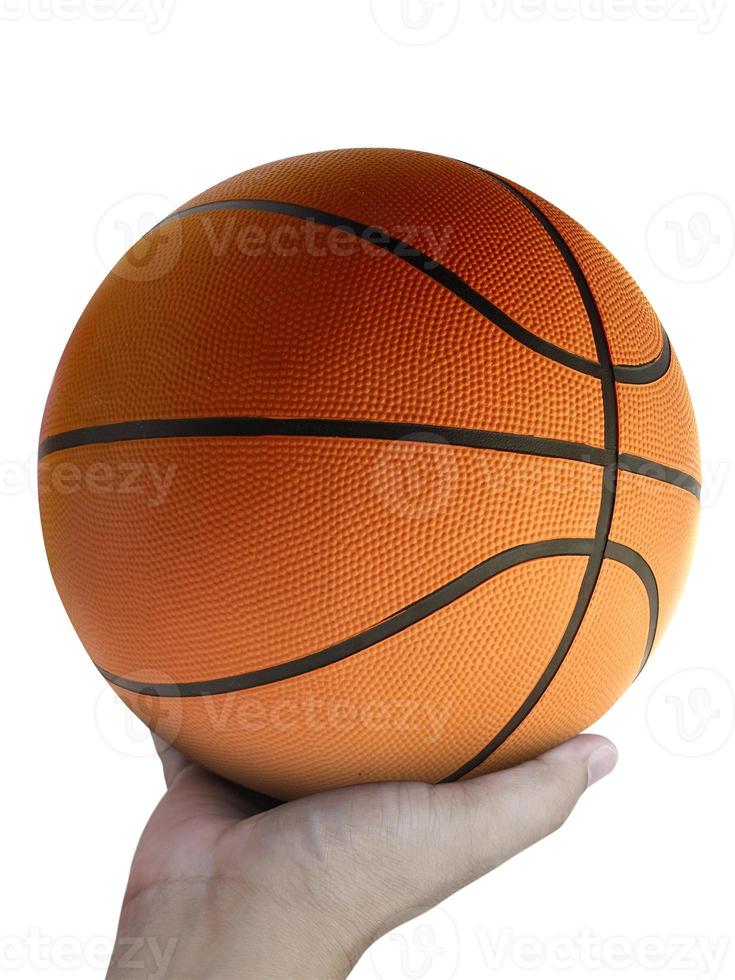 Basketball player holding a ball against white background photo
