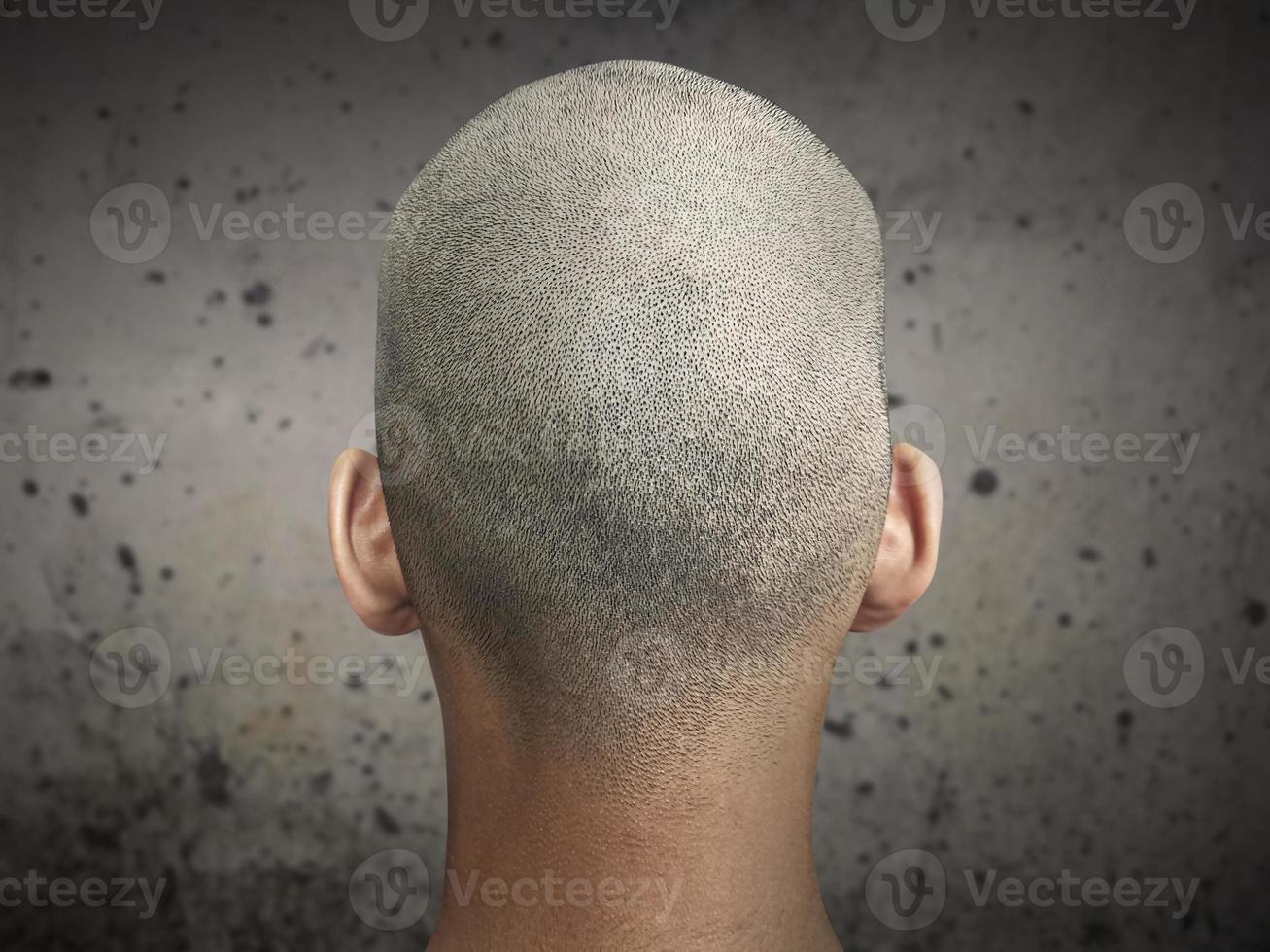 Young man with a shaved head photo