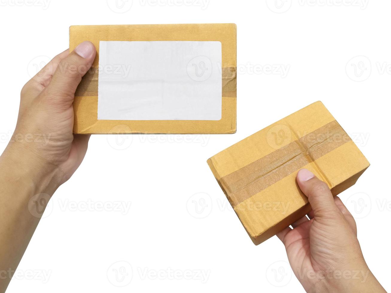 hand holding brown paper box package isolated on white background photo