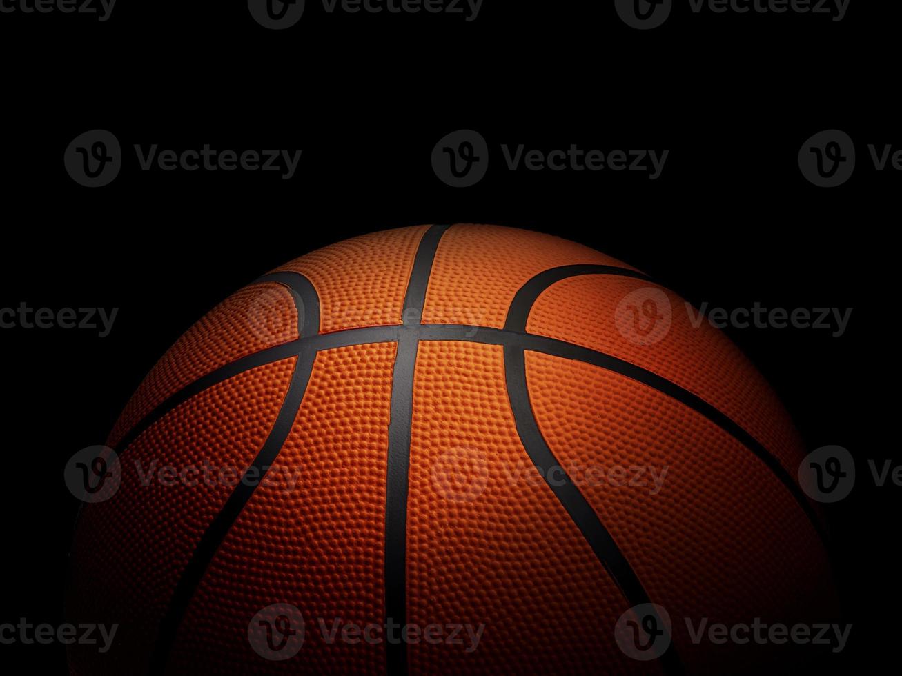 Basketball on black background photo