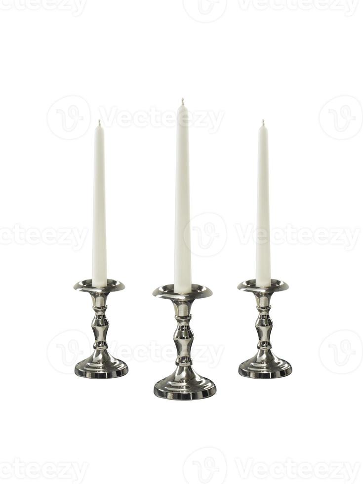 Candle on candlestick isolated on white background photo