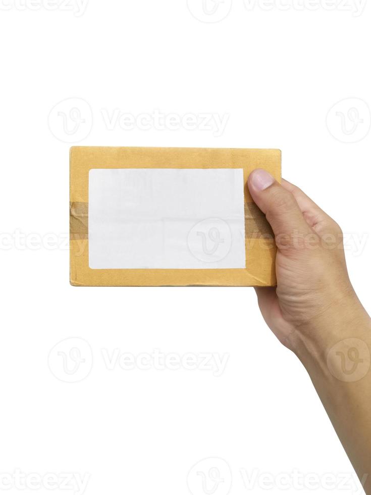 hand holding brown paper box package isolated on white background photo