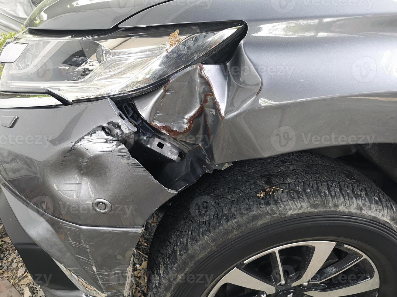 Front of car get damaged by accident on the road photo