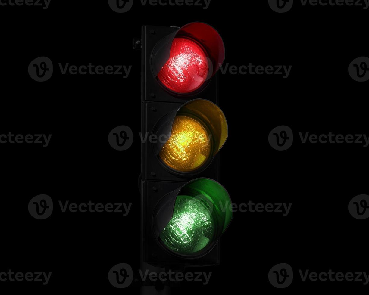 Traffic light on completely dark background photo