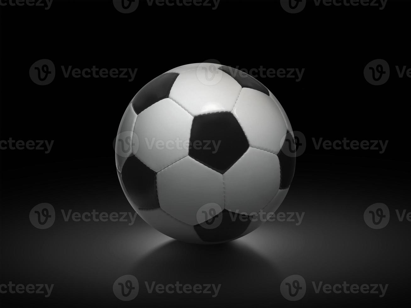 Soccer ball on black background photo