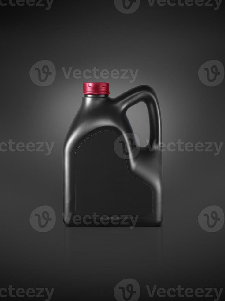 Gallon of engine oil on a dark black background photo